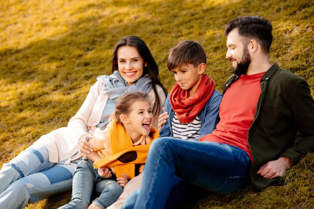 family on fall lawn